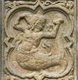 Panel 04:02 - Long-haired mermaid with comb and mirror